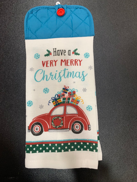 Christmas-themed hot pad with red car and text on a black background